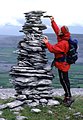 Tall cairns and small people